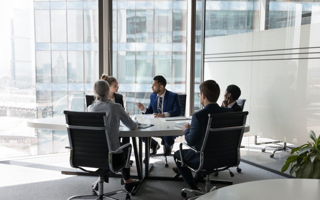 employees at a round table meeting